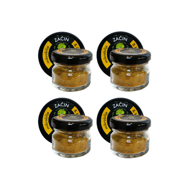 View of four jars of dried spice with turmeric arranged in a row. Visual representation of the availability of this spice that boosts immunity and gives an exotic note to every dish.