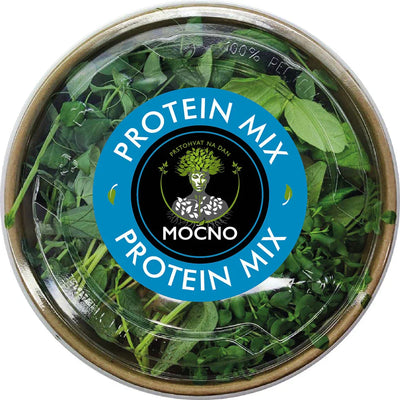 Shot of the Protein Mix lid from above. The focus is on the blue label design with the MOĆNO logo and clearly highlighted ingredients: pea, sunflower, lentil, fava bean, flax, and rapeseed.