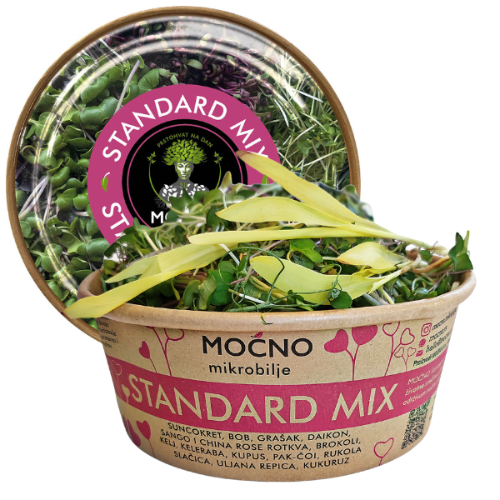 Main view of MOĆNO Standard Mix in sustainable eco-packaging. Clearly visible recognizable pink label on the lid with plenty of fresh microgreens.
